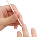 palillos naranjos de manicura